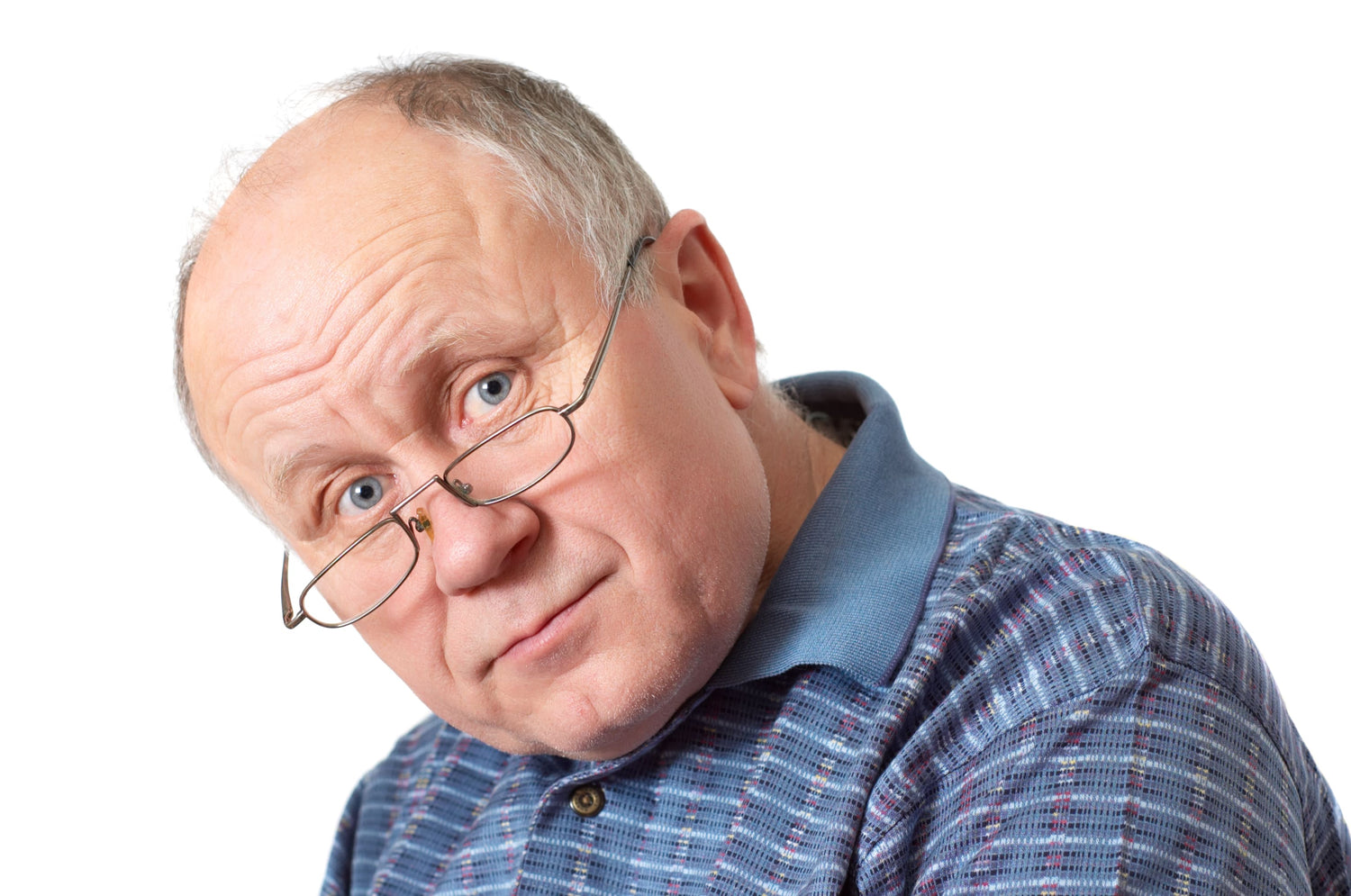 An old man with male pattern baldness and grey hair.